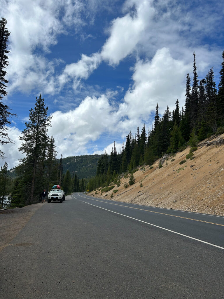 A truck carrying paddle boards parked on the side of the road at Diablo Lake in Oregon